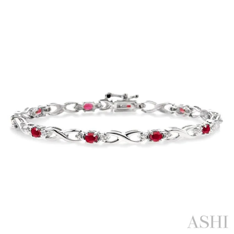 4x3mm Oval Cut Ruby and 1/10 Ctw Single Cut Diamond Bracelet in 10K White Gold