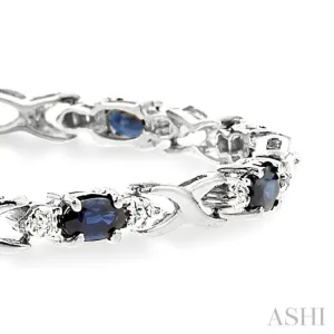 5x3mm Oval Cut Sapphire and 1/10 Ctw Single Cut Diamond Bracelet in 10K White Gold