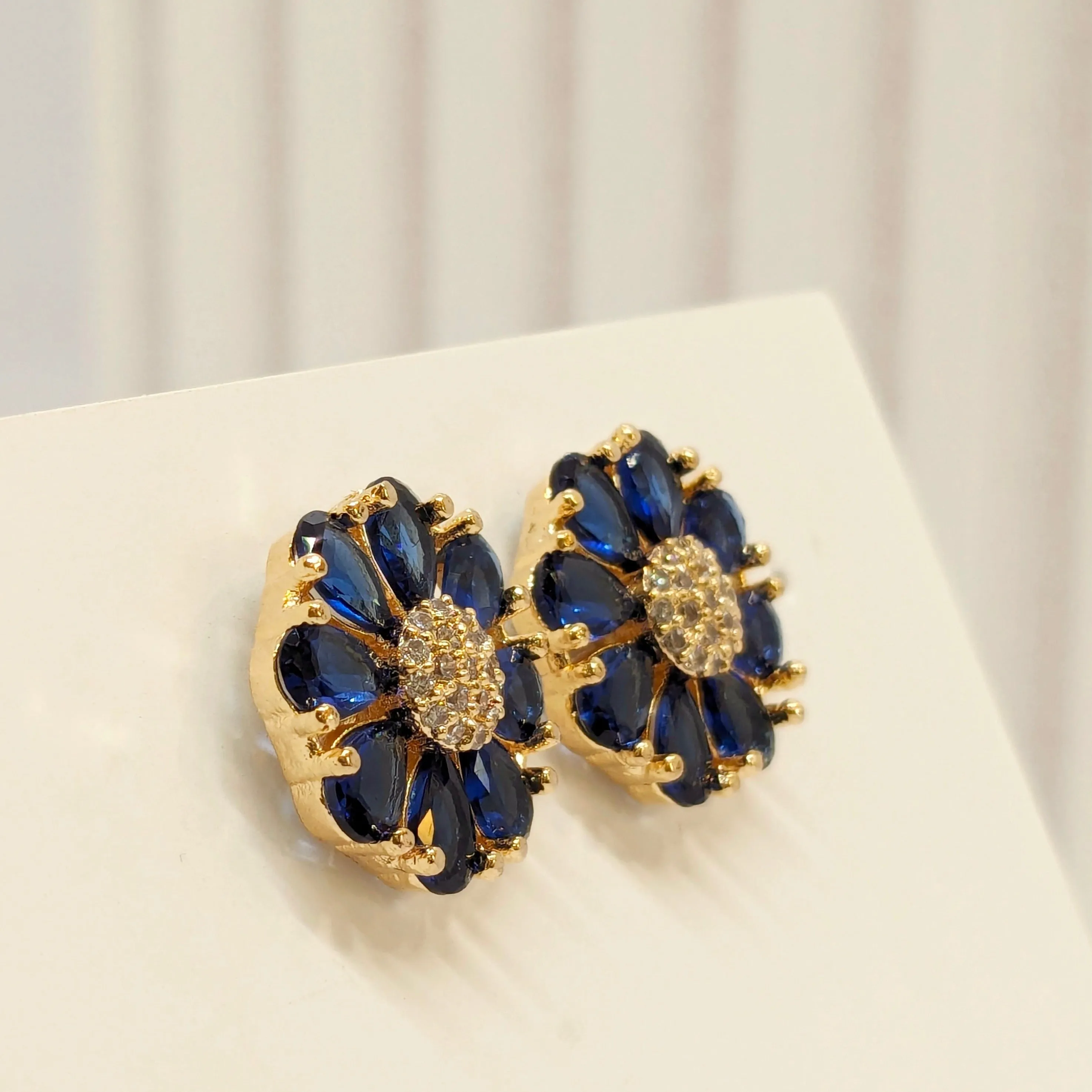 Fine Cut Navy Blue Stone Earring - Flower Pattern Studded with AD - Gold Finish