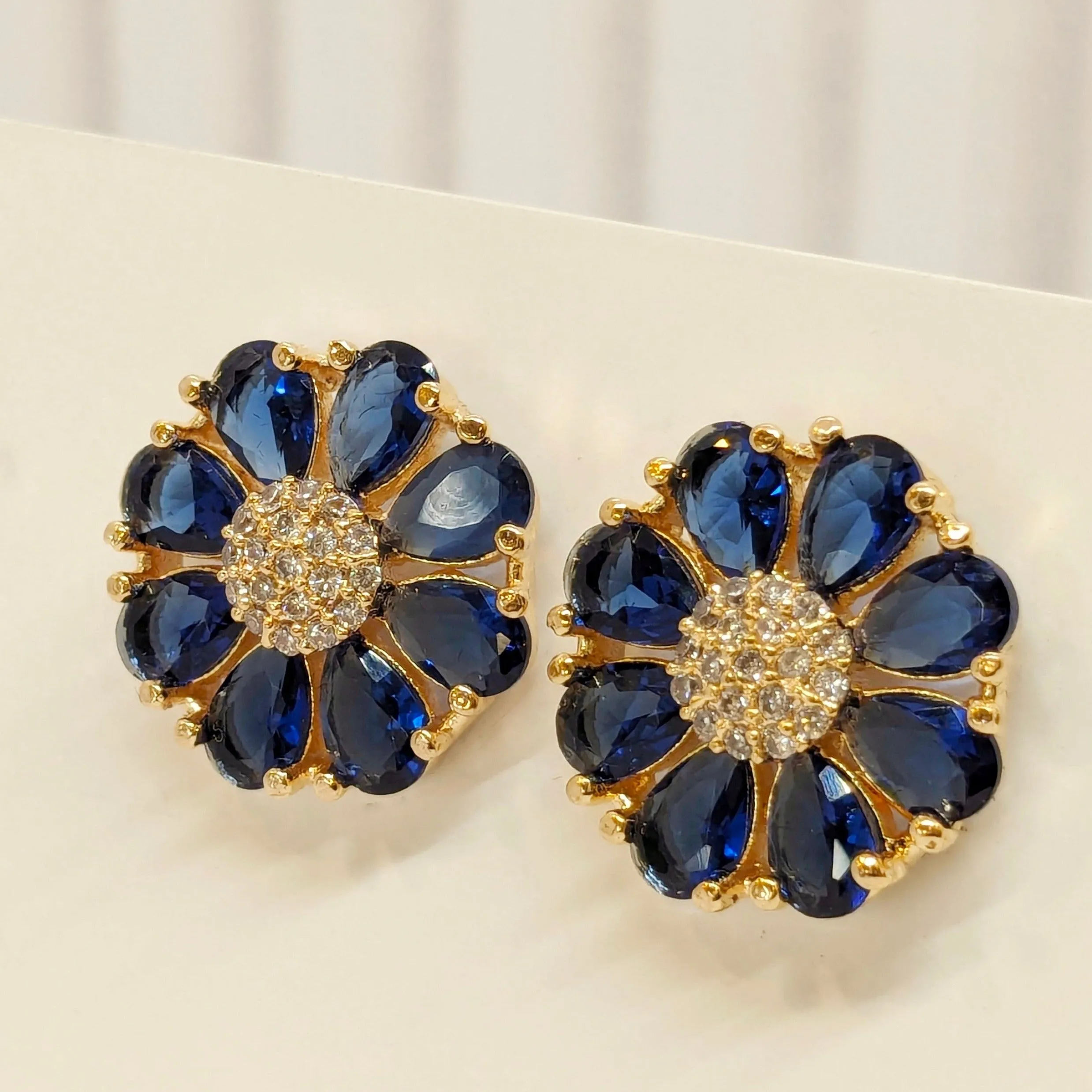 Fine Cut Navy Blue Stone Earring - Flower Pattern Studded with AD - Gold Finish